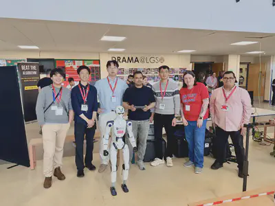 The DANiLab team with a full-size humanoid robot at a STEM event at LGS