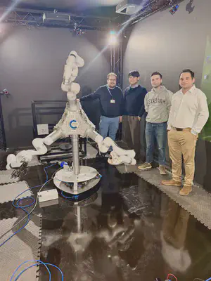 Members of the lab with a research robot